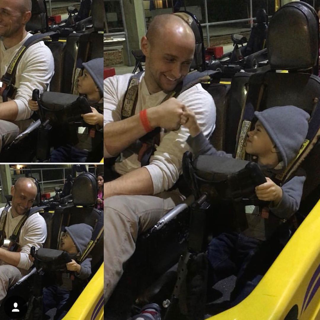 Craig Stratton fist-bumping his son on a ride