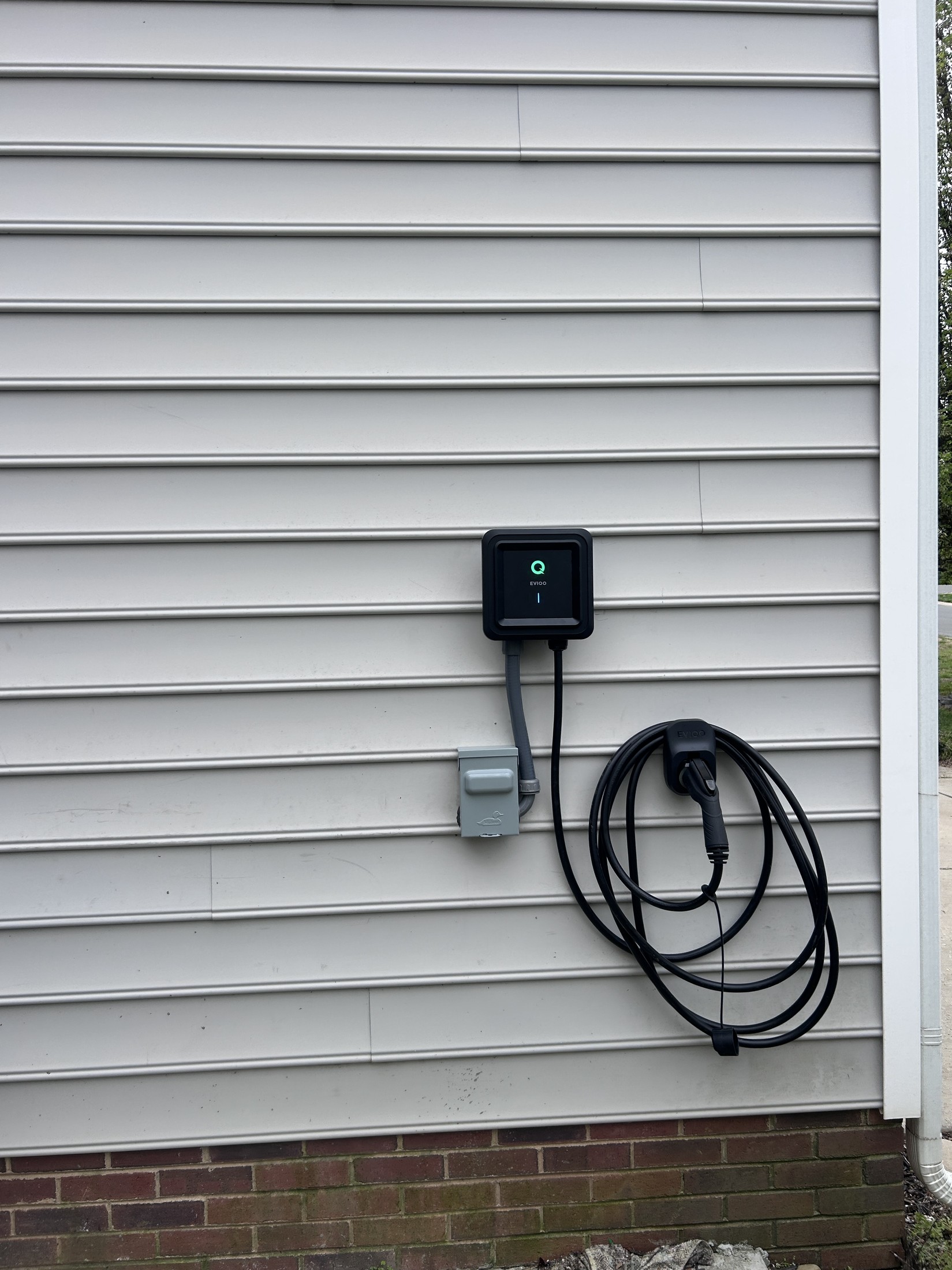 EV charger installed on a home exterior